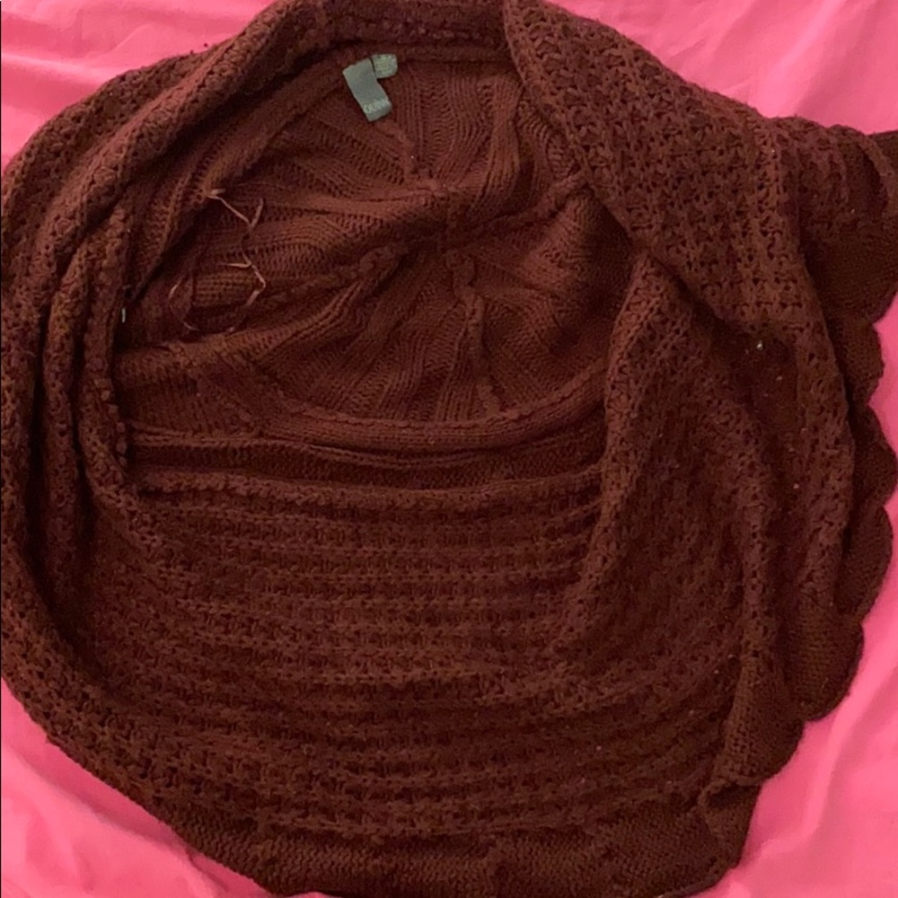 A brown/red colored sweater